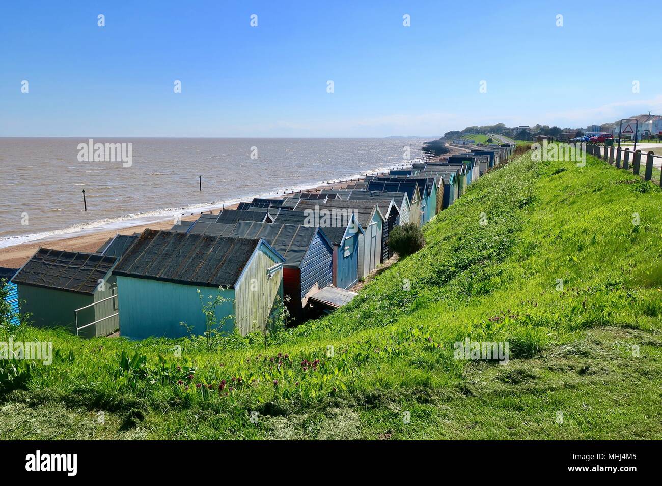 Beach huts at Felixstowe Ferry on a bright sunny May afternoon. 2018. Stock Photo