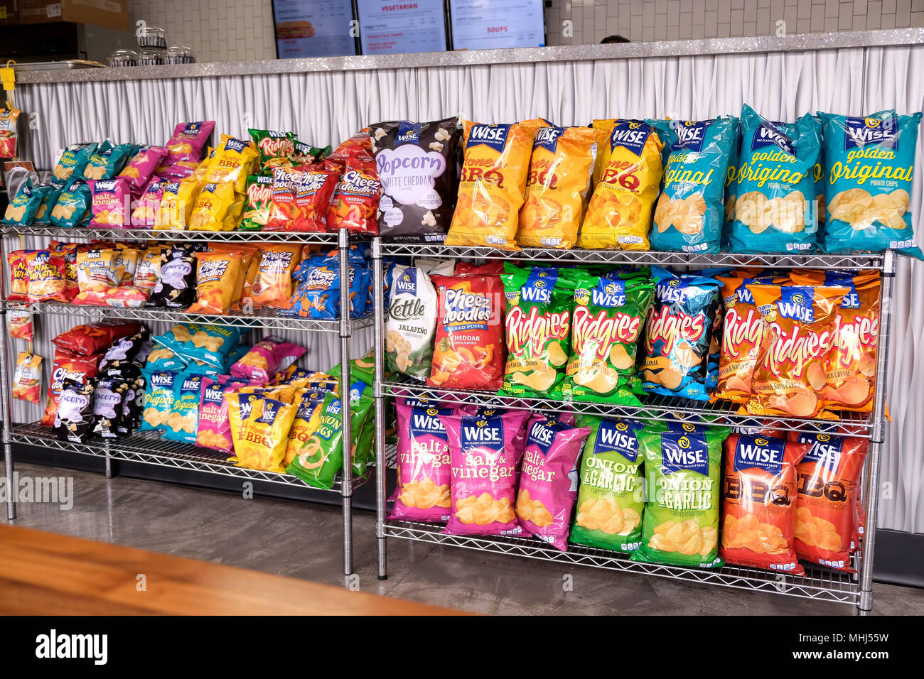 bags of crisps chips on sale in shop Stock Photo Alamy