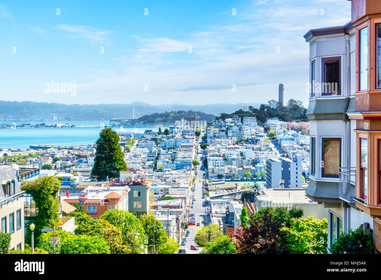 High-angle view of San Francisco skyline at Lombard Street toward San Francisco Bay in downtown North Beach community showing Fisherman's Wharf and Co Stock Photo