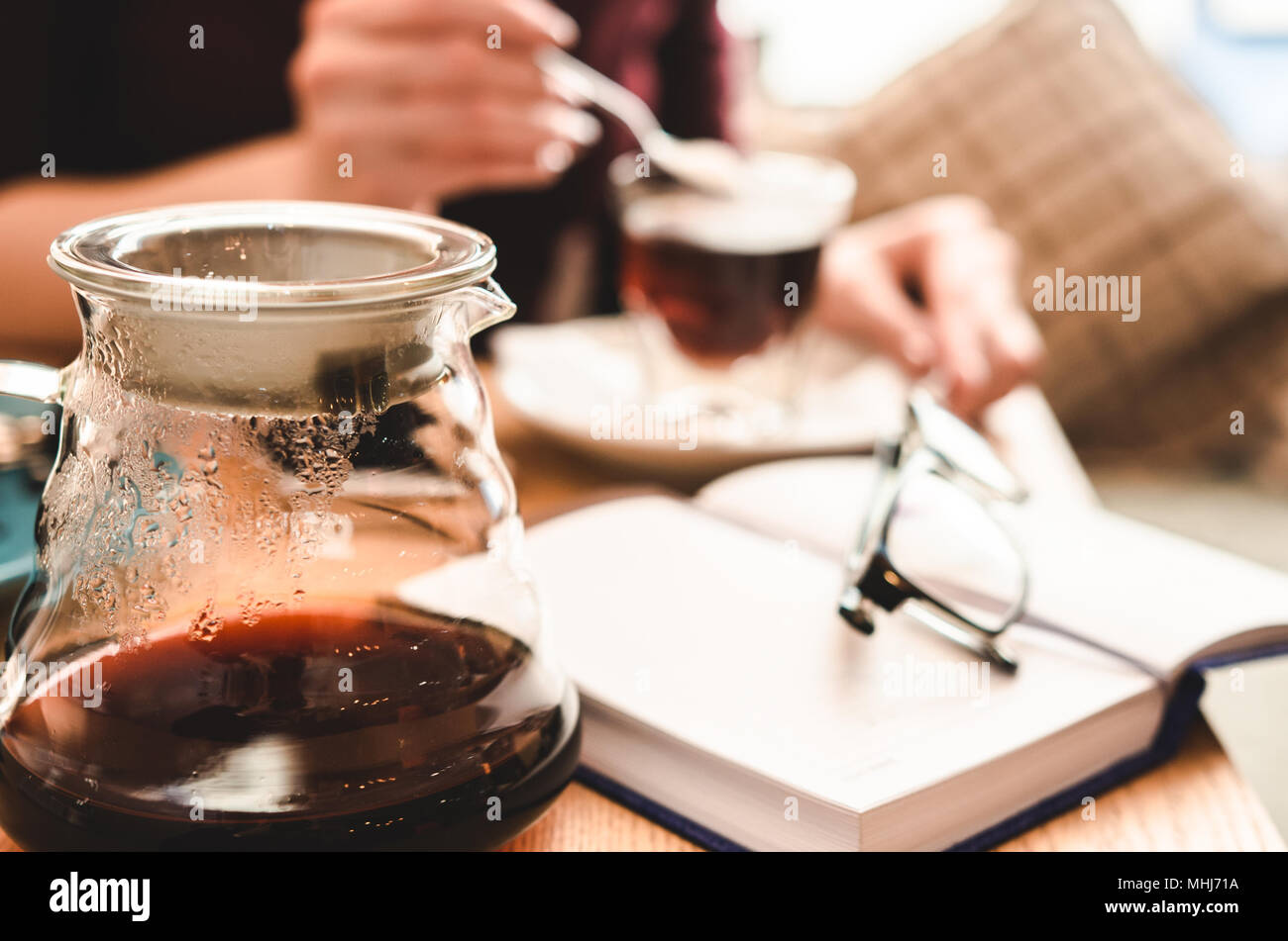 Cafe relaxation concept. Still life: glasses, note and coffee. Business lunch Stock Photo