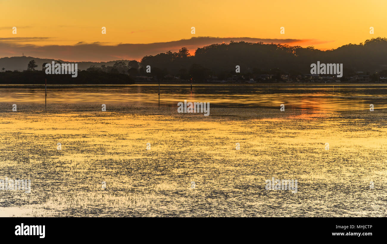 Dawn Waterscape - Capturing the sunrise from Woy Woy Waterfront on the Central Coast, NSW, Australia. Stock Photo