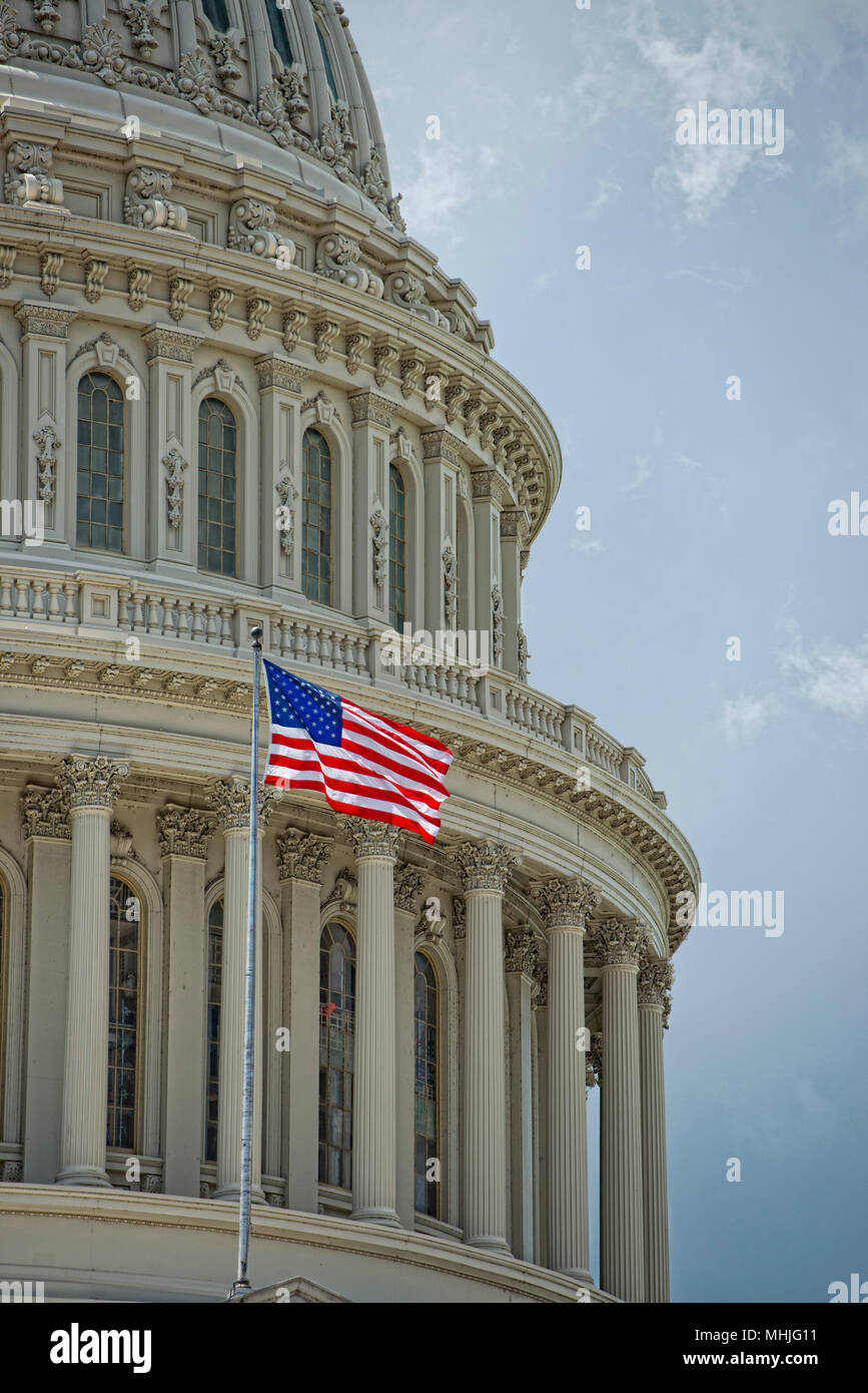Washington DC Capitol dome detail with waving american flag Stock Photo ...
