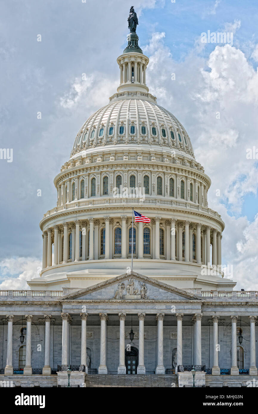 Washington DC Capitol dome detail with waving american flag Stock Photo ...