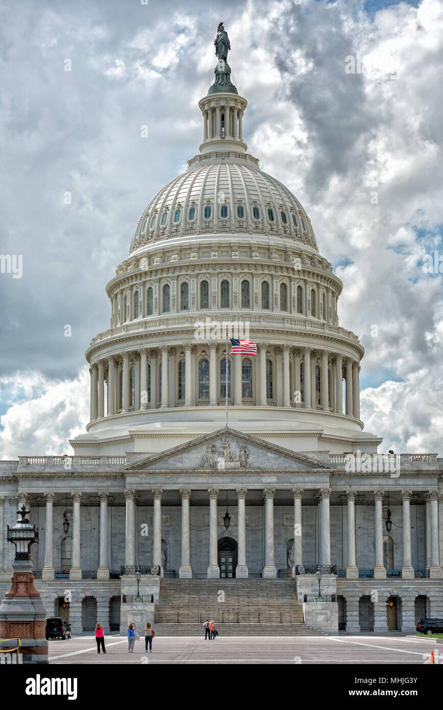 Washington DC Capitol dome detail with waving american flag Stock Photo ...