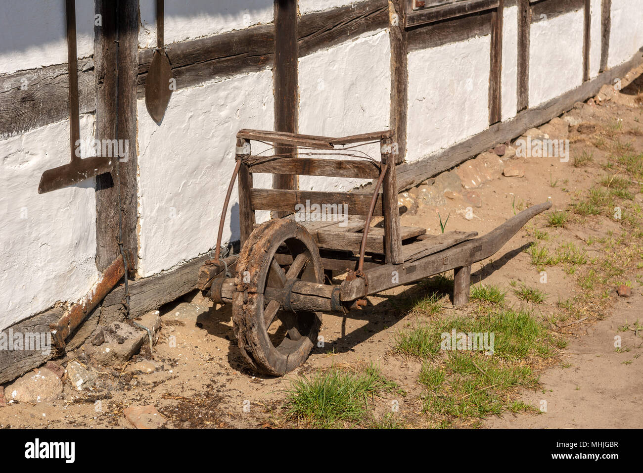 Old wooden wheelbarrow in museum of the Kluki village in Slowinski National Park. Poland Stock Photo