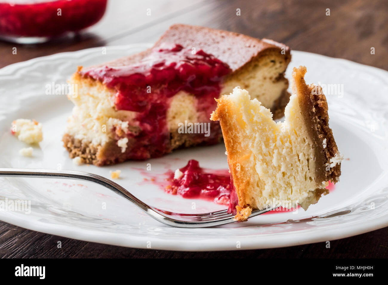 Homemade Raspberry Cheesecake in white plate for dessert Stock Photo ...
