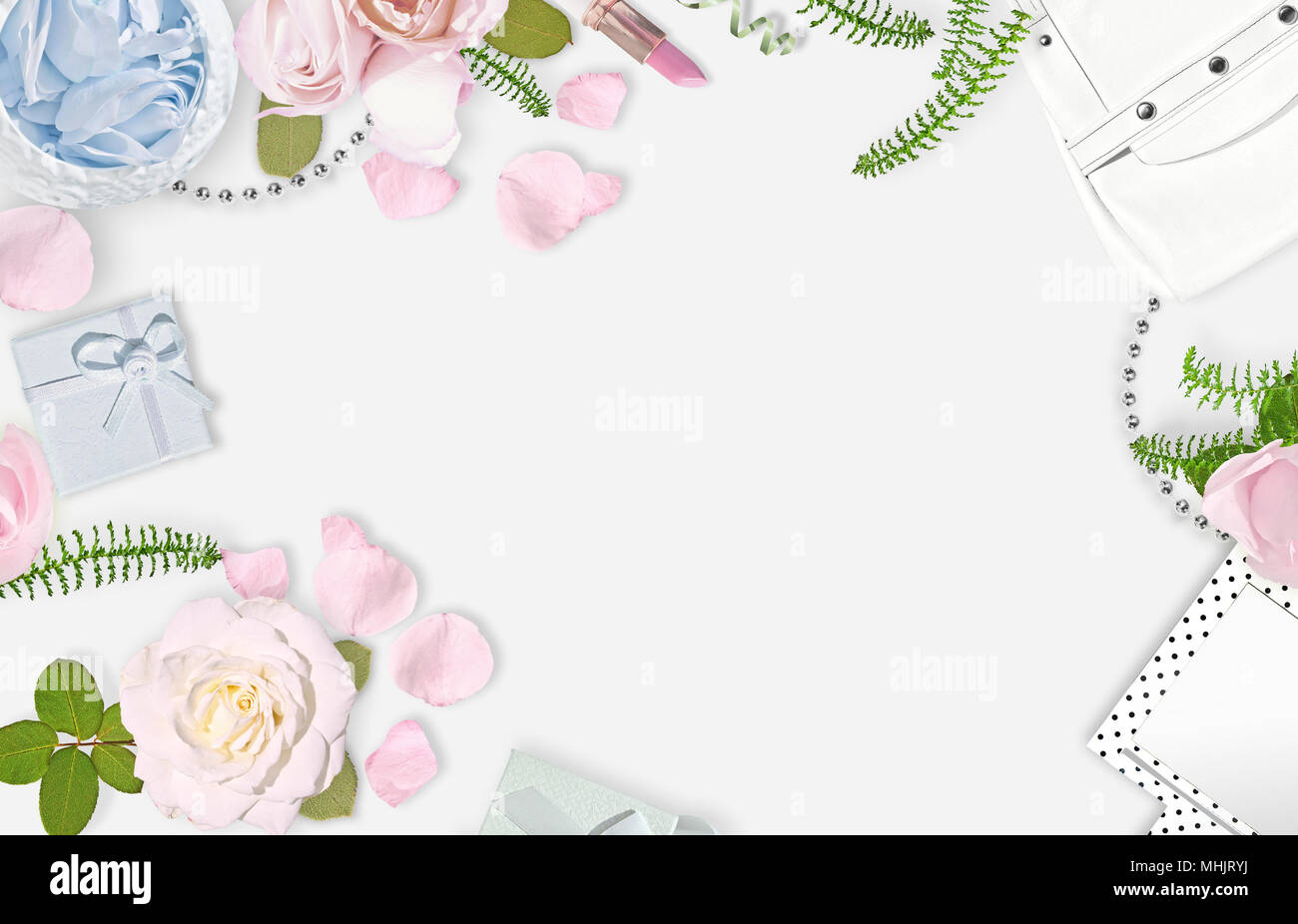 White feminine background. Flat lay. Pink roses, mirror, white bag. Place for text. Cheerful mind every day. Mother's day Stock Photo