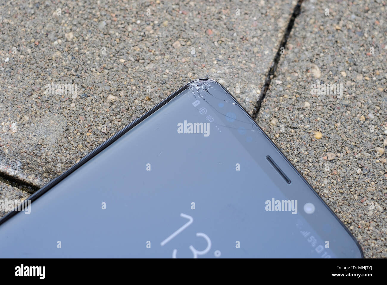 RIGA, APRIL 2018 - A smashed recently launched Samsung Galaxy S9 Plus smartphone with cracked screen is displayed for editorial purposes Stock Photo