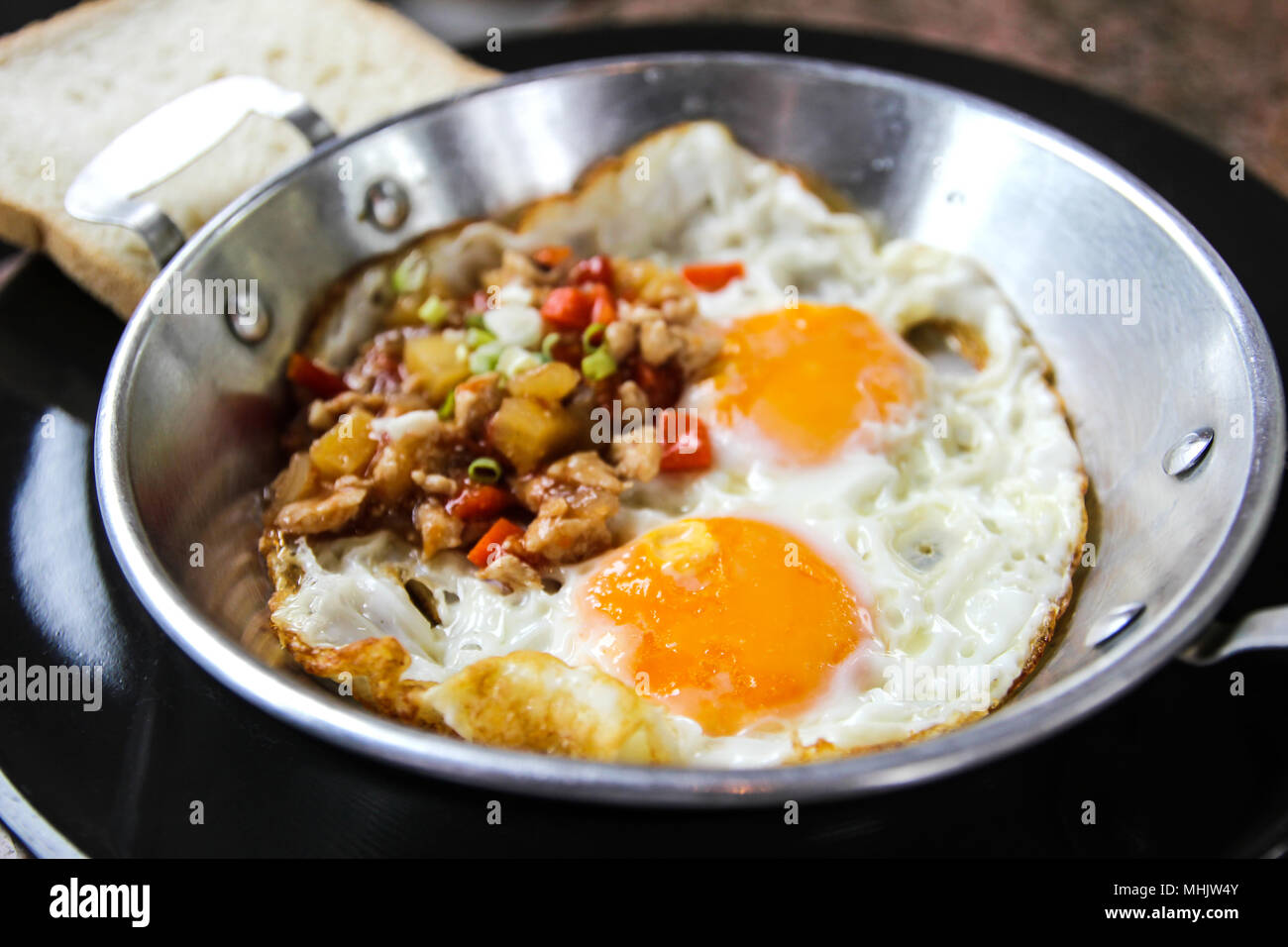 Indochina pan-fried egg with toppings in my homemade Thai style,egg pan. Stock Photo