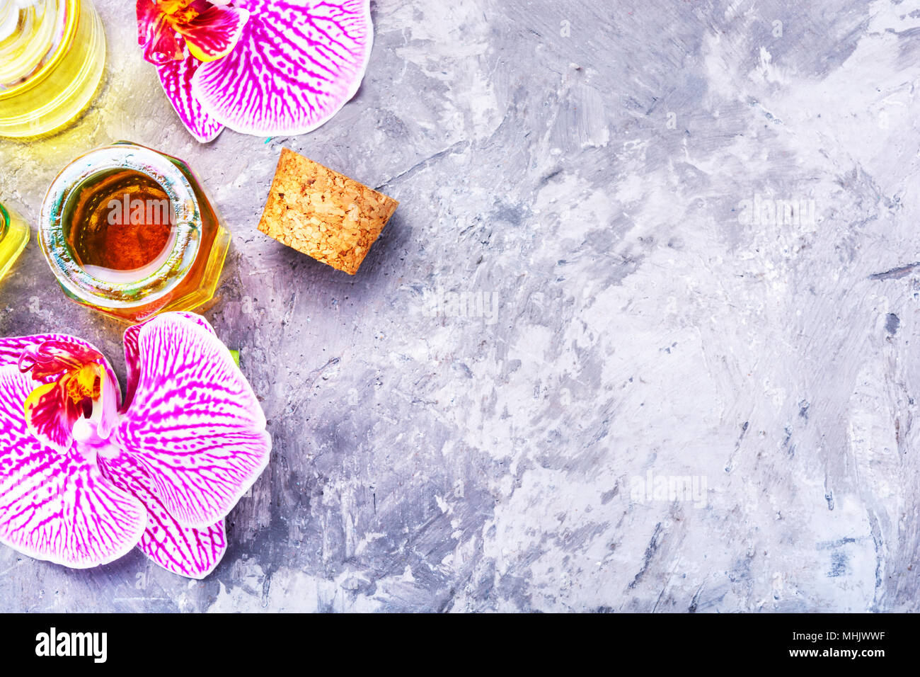 Bottle Of Essential Oil With Flowers Orchid Flower Aroma Essence Stock Photo Alamy