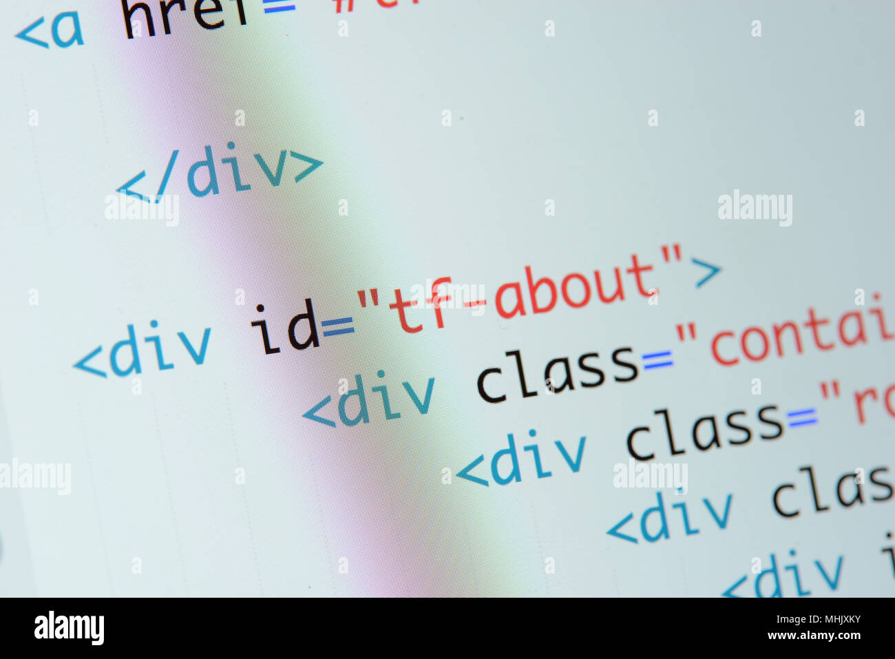 Real Html code developing screen. Programing workflow abstract algorithm concept. Lines of Html code visible. Stock Photo