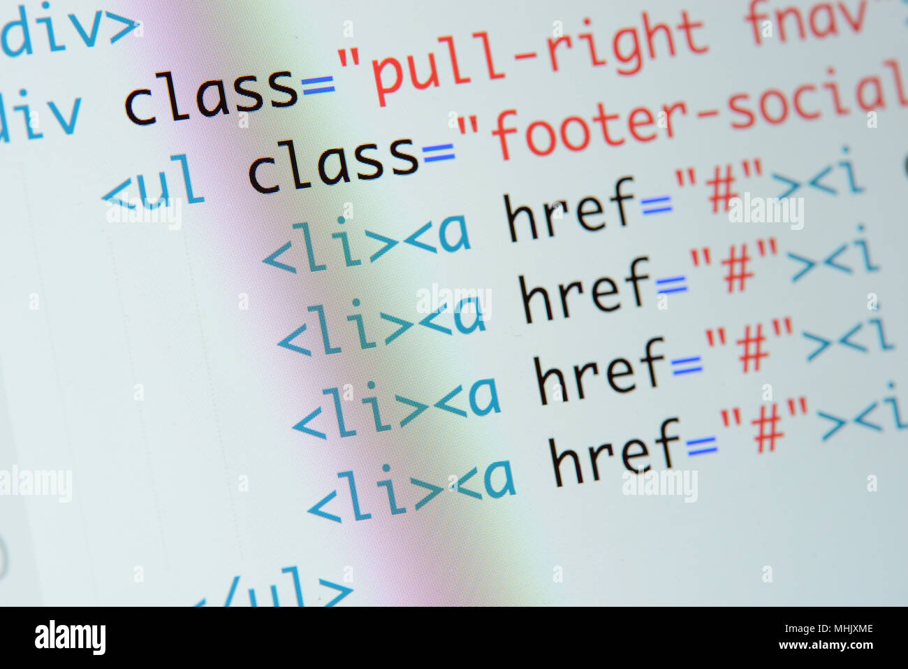 Real Html code developing screen. Programing workflow abstract algorithm concept. Lines of Html code visible. Stock Photo