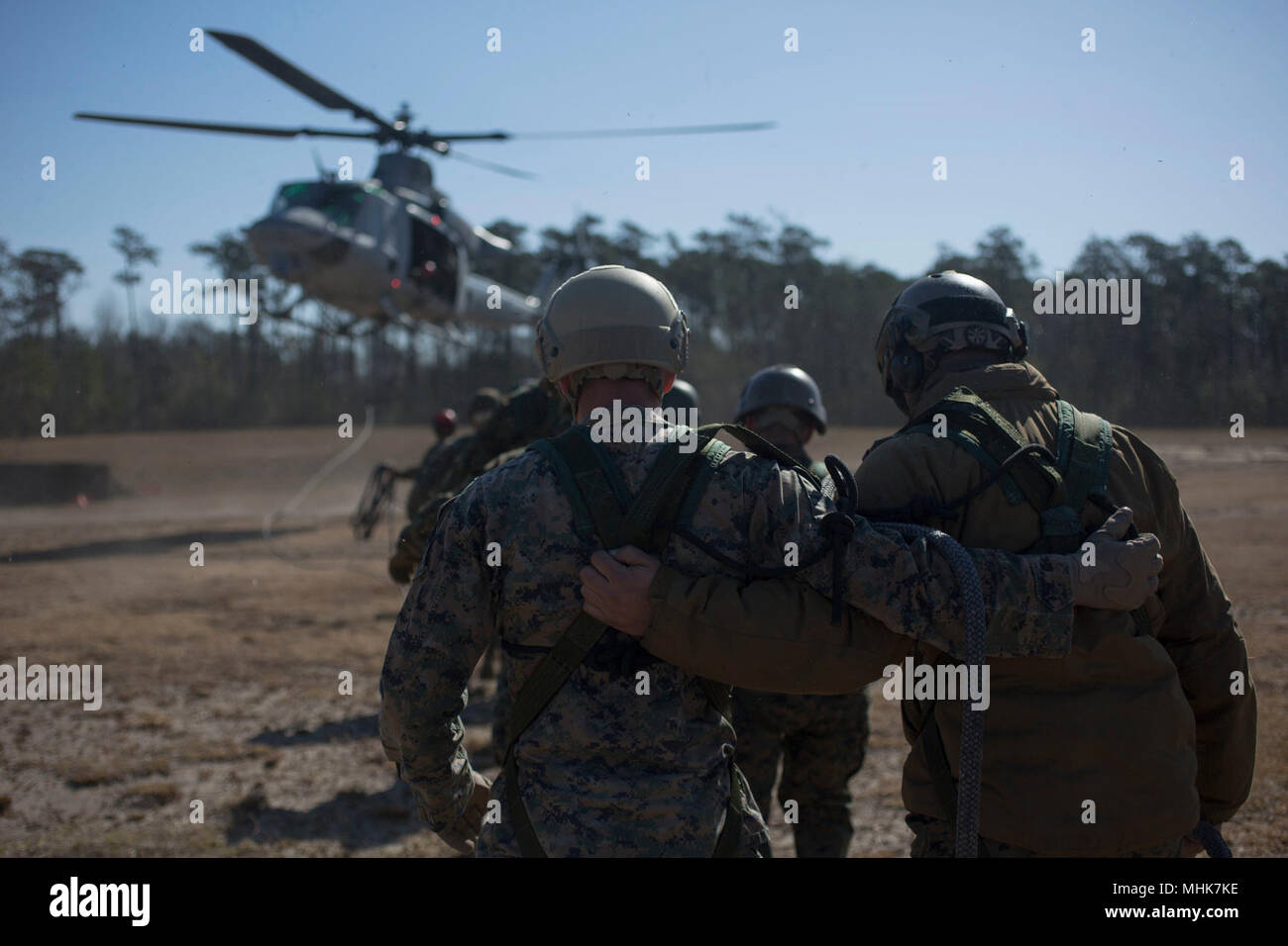 U.S. Marines with II Marine Expeditionary Force Information Group prepare to be lifted from the ground during special patrol insertion and extraction operations training at Camp Lejeune, N.C., March 23, 2018. The Marines conducted the training to improve operational capabilities and to recertify helicopter rope suspension techniques masters from across II MEF. (U.S. Marine Corps Stock Photo