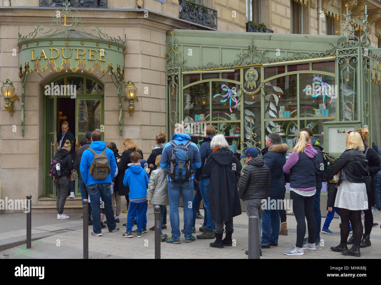 Customers and tourists lining up at Laduree on the Champs-Elysees avenue, Paris FR Stock Photo