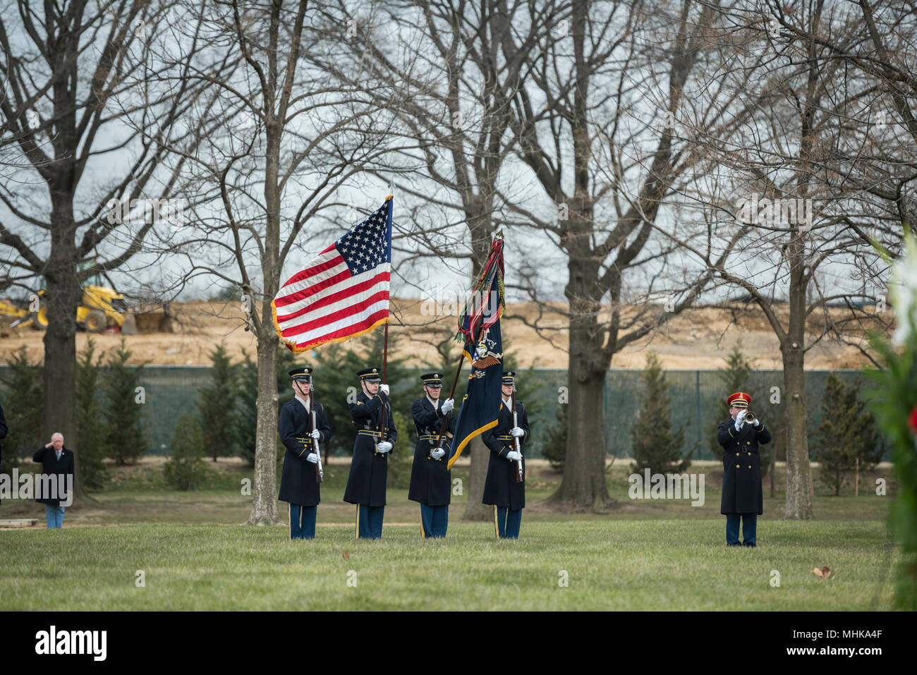 The U.S. Army Honor Guard and a bugler from The U.S. Army Band, “Pershing’s Own”, assist in conducting the full honors repatriation of U.S. Army Cpl. Dow F. Worden in Section 60 of Arlington National Cemetery, Arlington, Virginia, March 27, 2018.    Worden, 20, from Boardman, Oregon, went unaccounted in late September 1951 during the Korean War. A member of Company A, 1st Battalion, 9th Infantry Regiment, 2nd Infantry Division, Worden’s company was in the vicinity of Hill 1024 in South Korea, conducting operations near an area known as Heartbreak Ridge, when the Chinese launched an attack. The Stock Photo