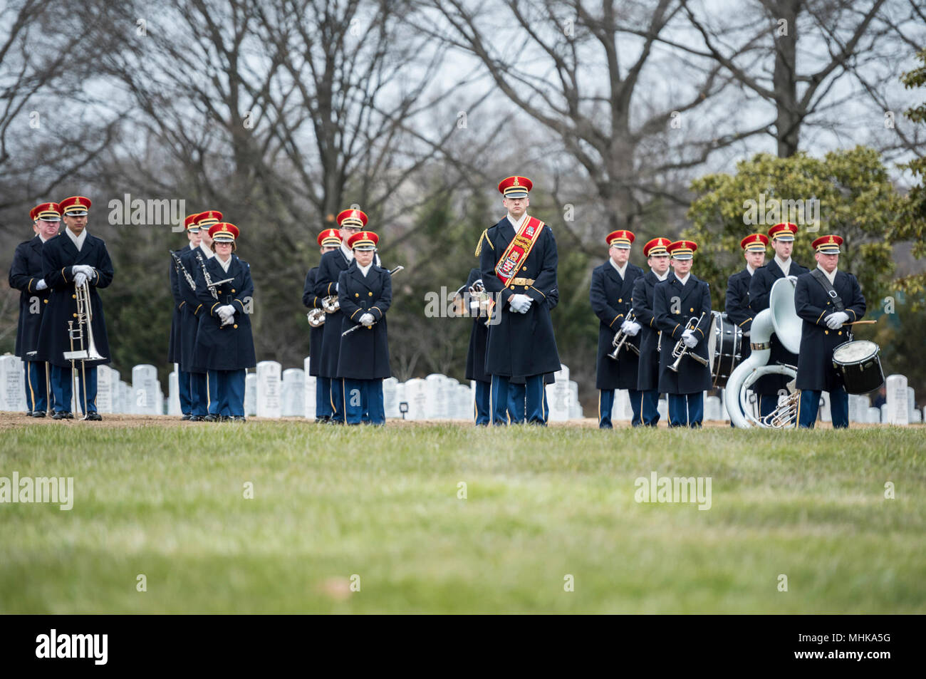 The U.S. Army Band, “Pershing’s Own”, assist in conducting the full honors repatriation of U.S. Army Cpl. Dow F. Worden in Section 60 of Arlington National Cemetery, Arlington, Virginia, March 27, 2018.    Worden, 20, from Boardman, Oregon, went unaccounted in late September 1951 during the Korean War. A member of Company A, 1st Battalion, 9th Infantry Regiment, 2nd Infantry Division, Worden’s company was in the vicinity of Hill 1024 in South Korea, conducting operations near an area known as Heartbreak Ridge, when the Chinese launched an attack. The company repelled and was relieved by the Re Stock Photo