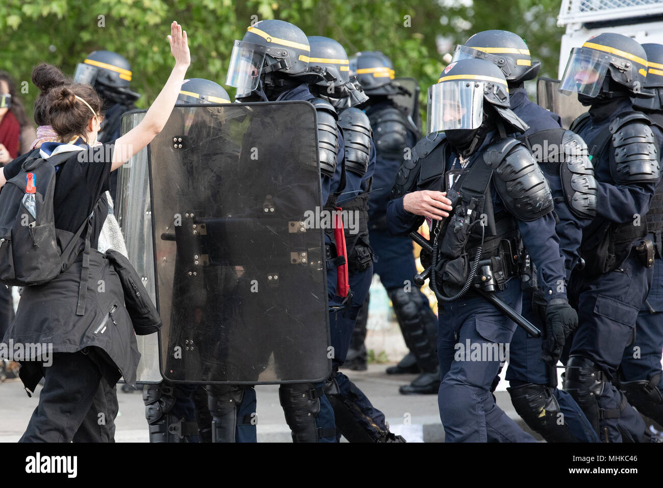 Paris, France. 1st May 2018. Workers Day manifestation. Two females challenge police during the May Day resistance as the police try to clear the area after rioting. 1st May 2018. Paris, France. Credit: Paul Roberts/Alamy Live News Stock Photo