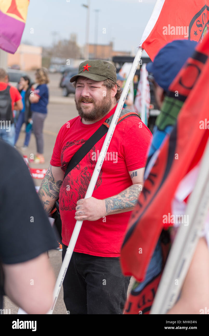MINNEAPOLIS - May 1: A man supporting socialism waits for the International Workers’ Day March, hosted by a number of community organizations and labor unions. Credit: Nicholas Neufeld/Alamy Live News Stock Photo