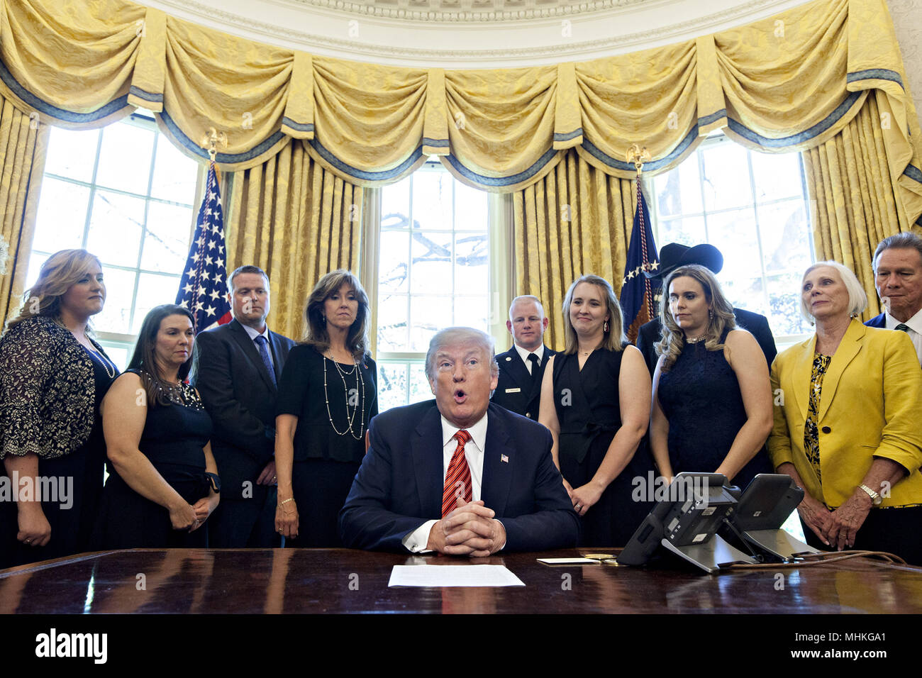 Washington, DC, USA. 1st May, 2018. United States President Donald Trump, center, speaks while meeting with the crew and passengers of Southwest Airlines Co. flight 1380 in the Oval Office of the White House in Washington, DC, U.S., on Tuesday, May 1, 2018. An engine on Southwest's flight 1380, a Boeing Co. 737-700 bound for Dallas from New York's LaGuardia airport, exploded and made an emergency landing on April 17 sending shrapnel into the plane and killing a passenger seated near a window. Credit: Andrew Harrer/Pool via CNP | usage worldwide Credit: dpa/Alamy Live News Stock Photo