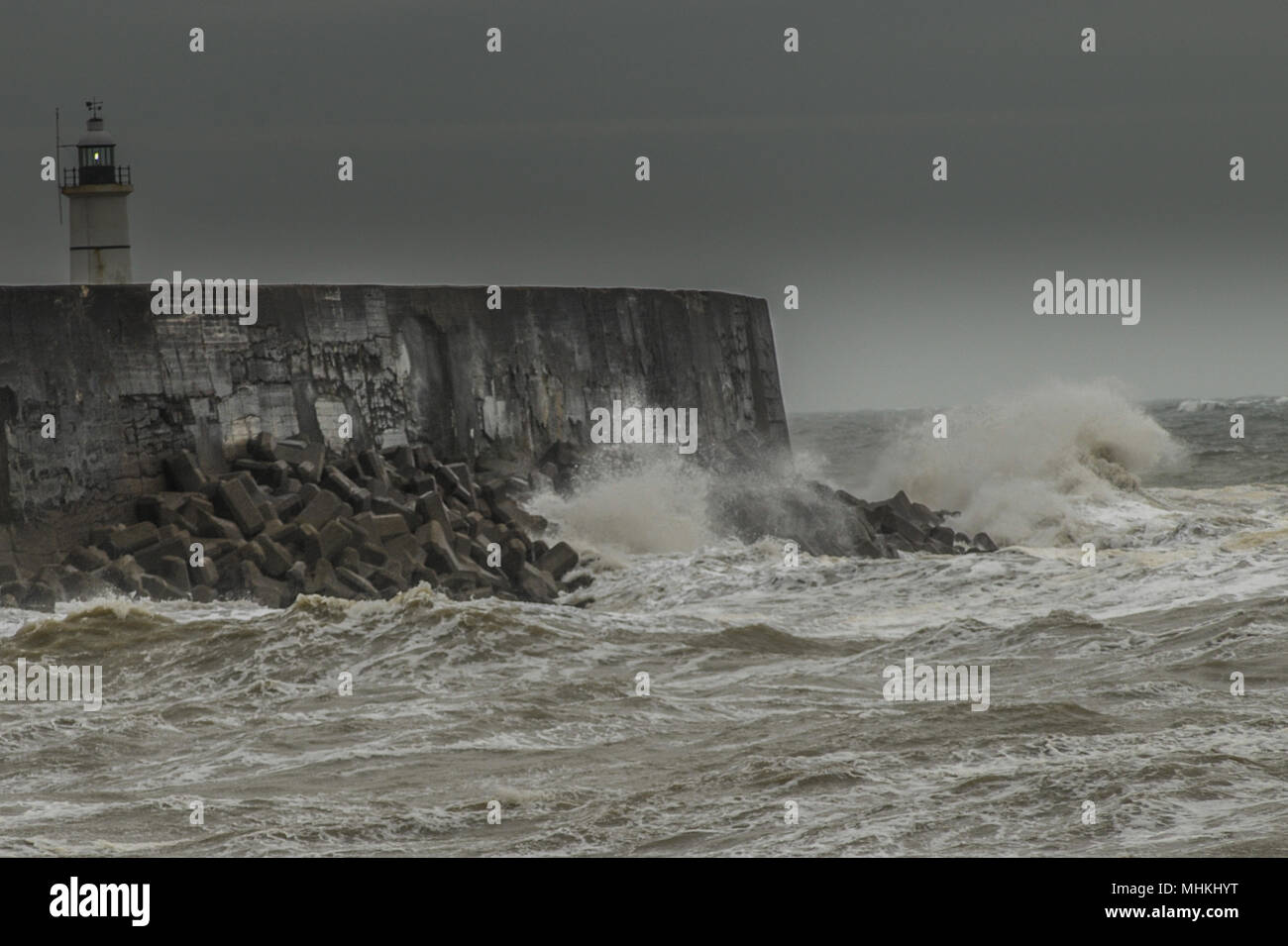 Newhaven, East Sussex, UK..2 May 2018..Increasing wind whipping up the surf at the West Breakwater.. Stock Photo