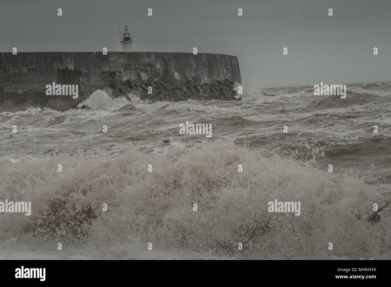 Newhaven, East Sussex, UK..2 May 2018..Increasing wind whipping up the surf at the West Breakwater.. Stock Photo