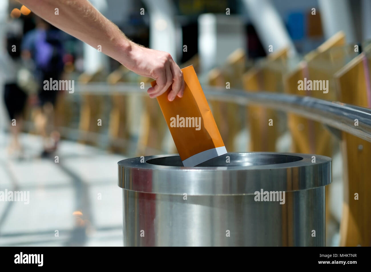 Putting rubbish into recycle bin hires stock photography and images
