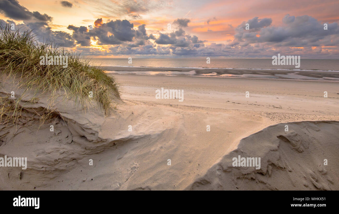 Sunset View on North Sea and Canal fom dunes in Zeeland, Netherlands Stock Photo