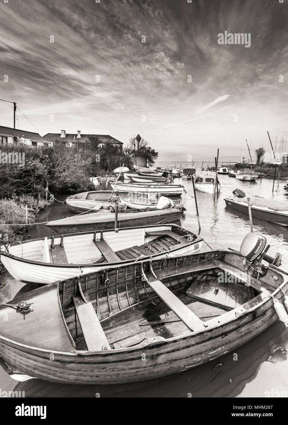 Boats at the harbour quay in black and white Stock Photo