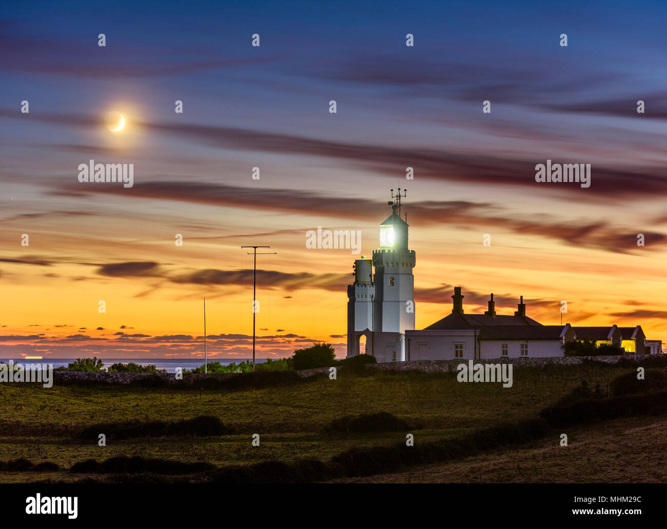 St Catherine's Lighthouse with a crescent moon Stock Photo Alamy