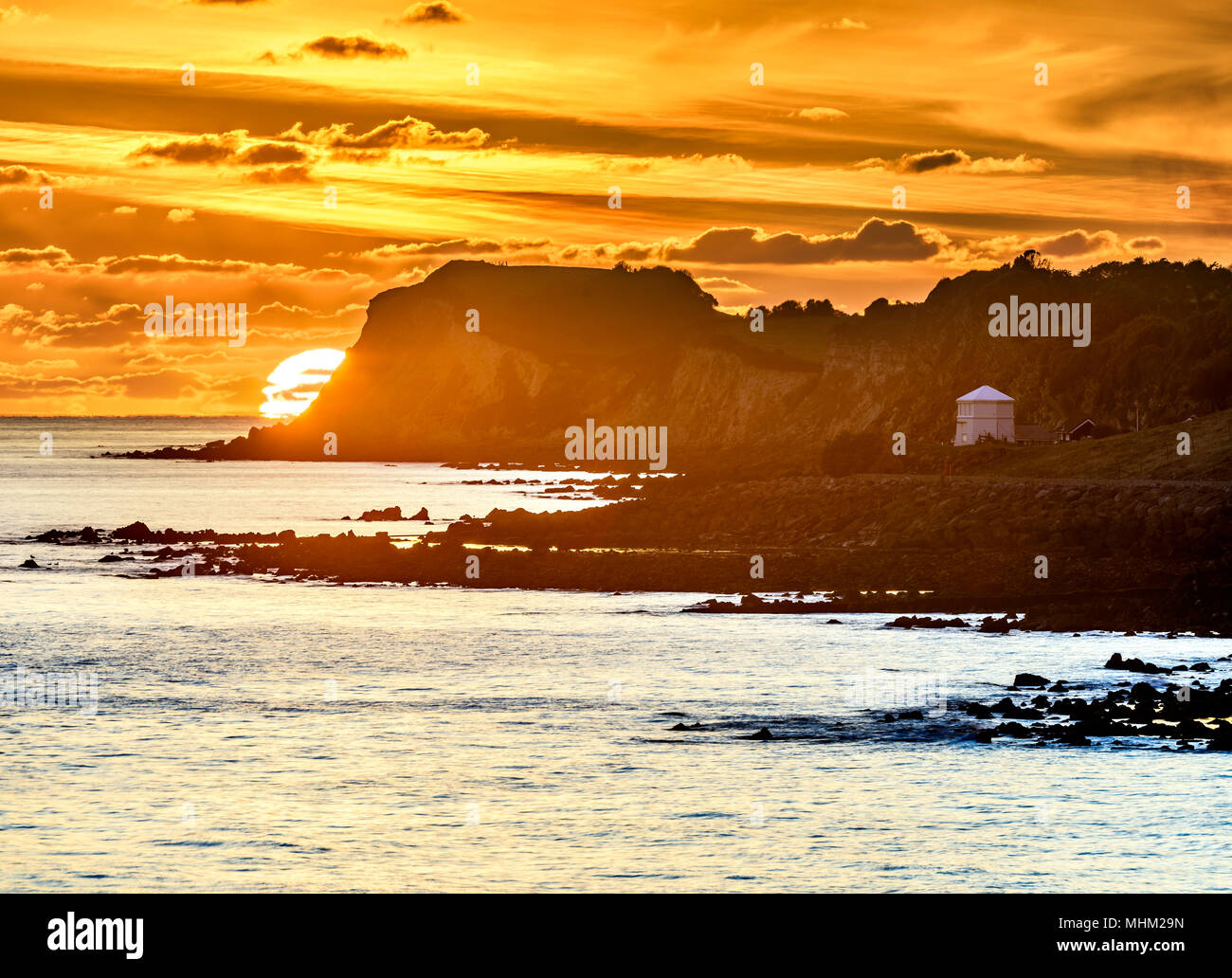 Telephoto orange sunset at the coast, Ventnor Isle of Wight Stock Photo