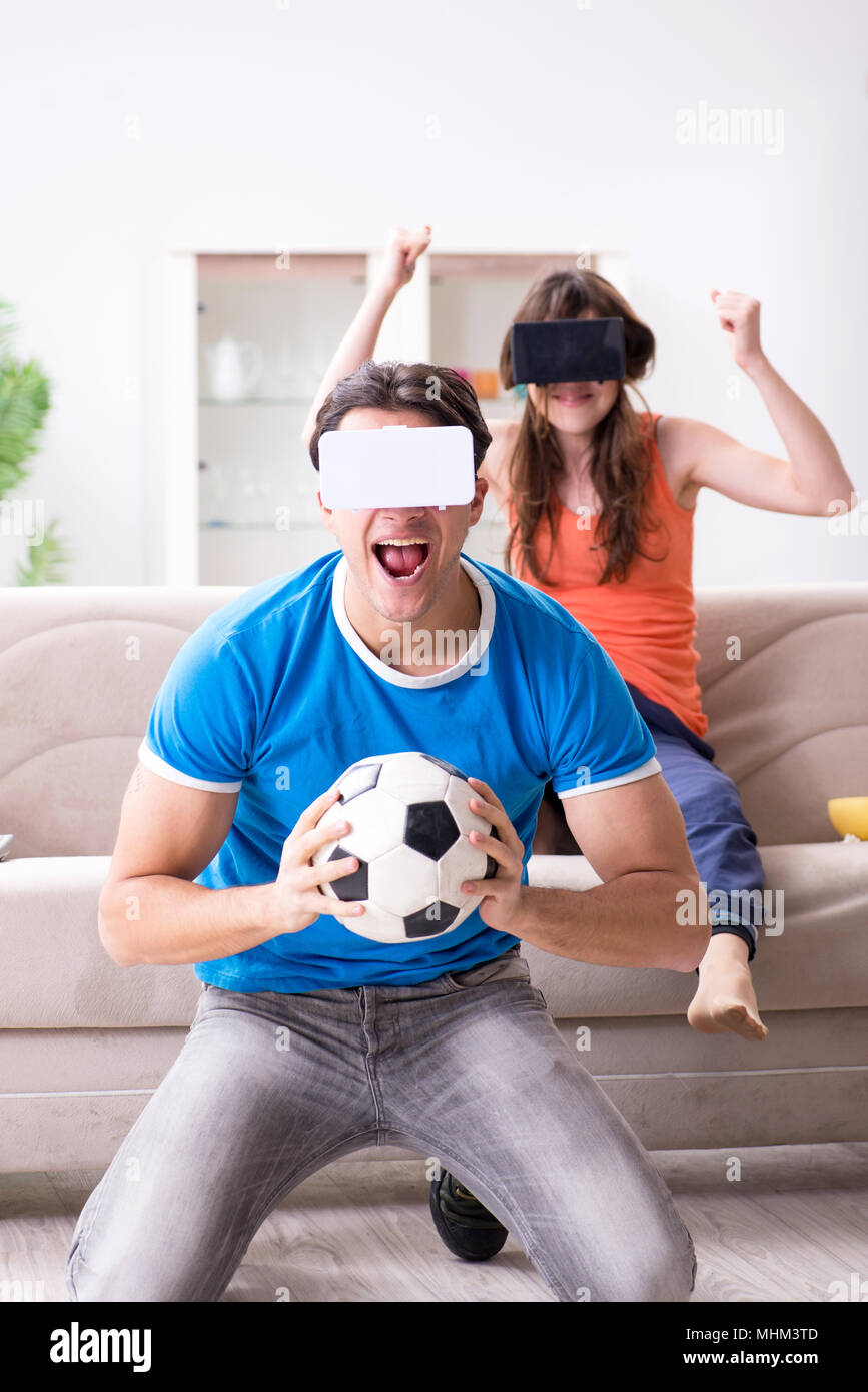 Man watching football on virtual reality vr glasses Stock Photo Alamy
