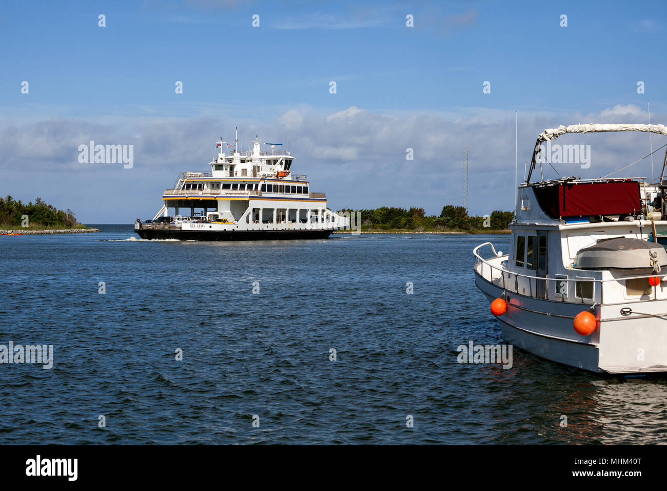 NC01579-00...NORTH CAROLINA - Ferry boat Sea Level entering Silver Lake Harbor in the town of Ocracoke on Ocracoke Island part of the Outer Banks. Stock Photo