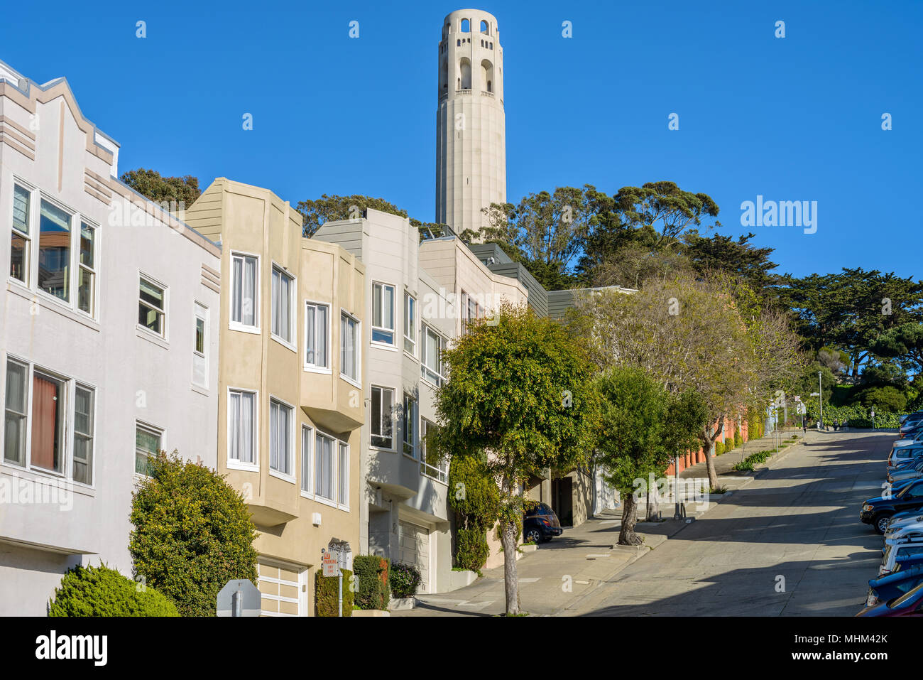 Coit Tower - A close-up view of Coit Tower in Telegraph Hill neighborhood, as seen from steep Filbert Street, San Francisco, California, USA. Stock Photo