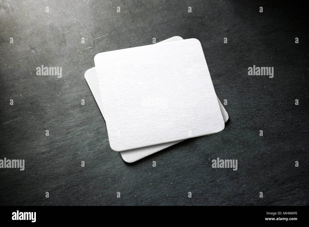 Blank white beer coaster stack mockup top view lying on the