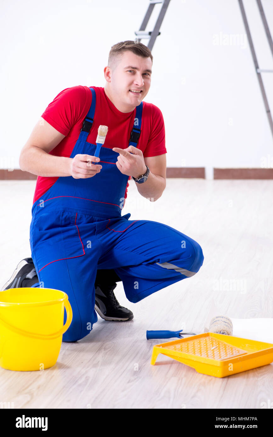 Male painter preparing for painting job at construction site Stock Photo Alamy