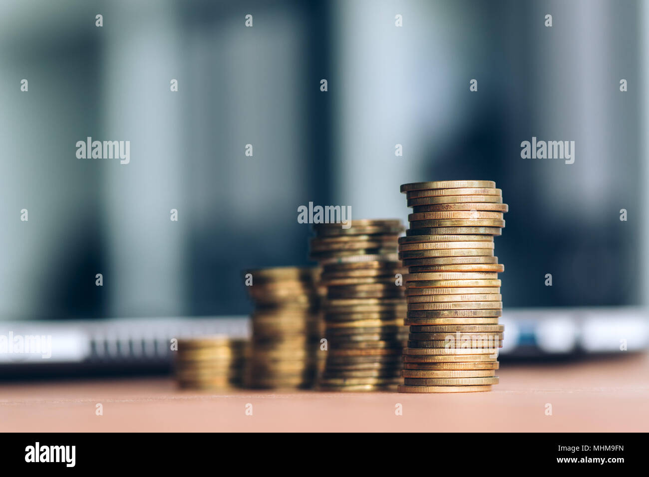 Coin stack on office desk, close up with selective focus Stock Photo