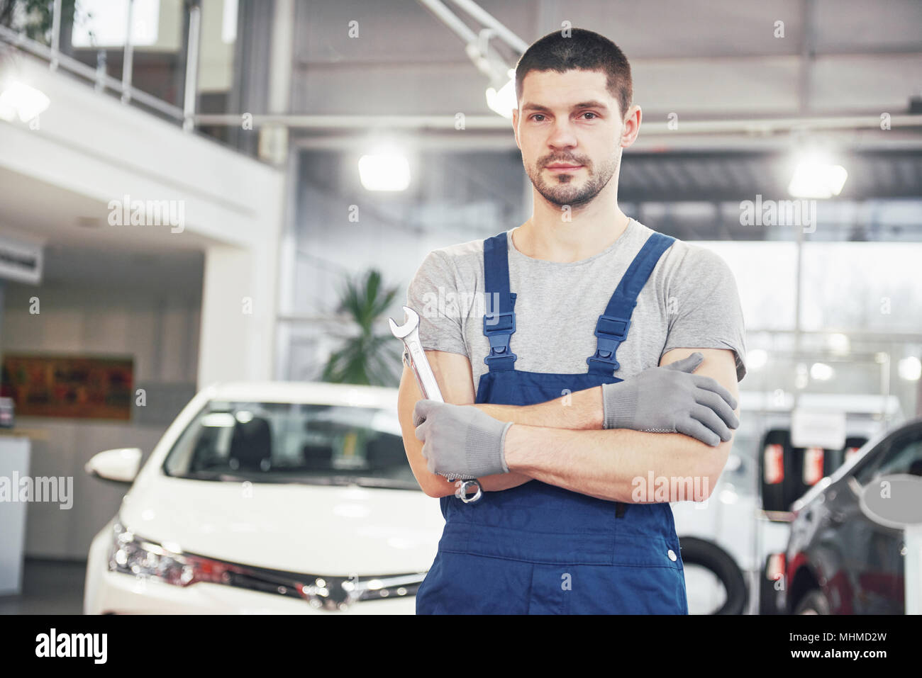 Hand of car mechanic with wrench. Auto repair garage Stock Photo Alamy