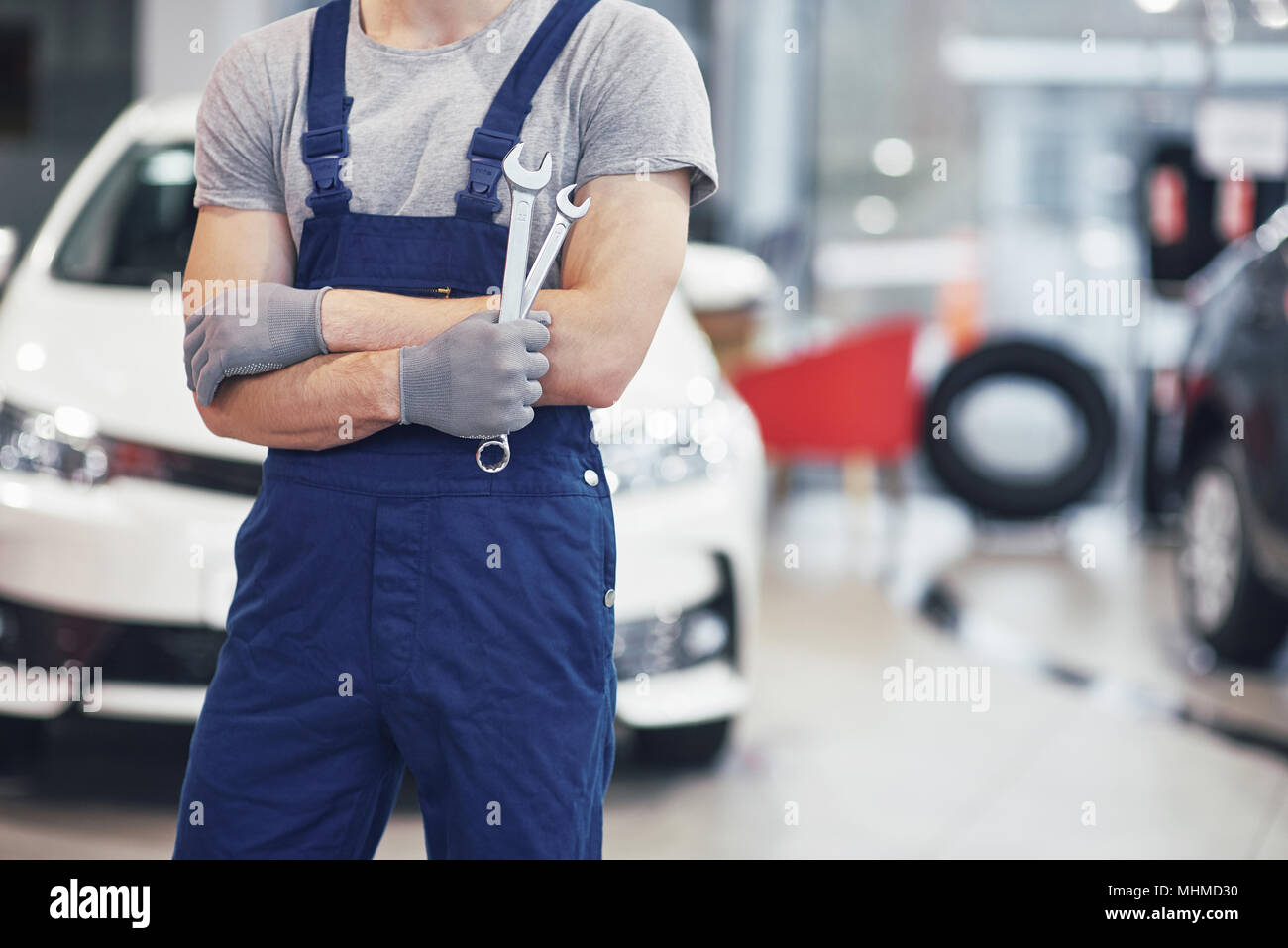 Hand of car mechanic with wrench. Auto repair garage Stock Photo Alamy