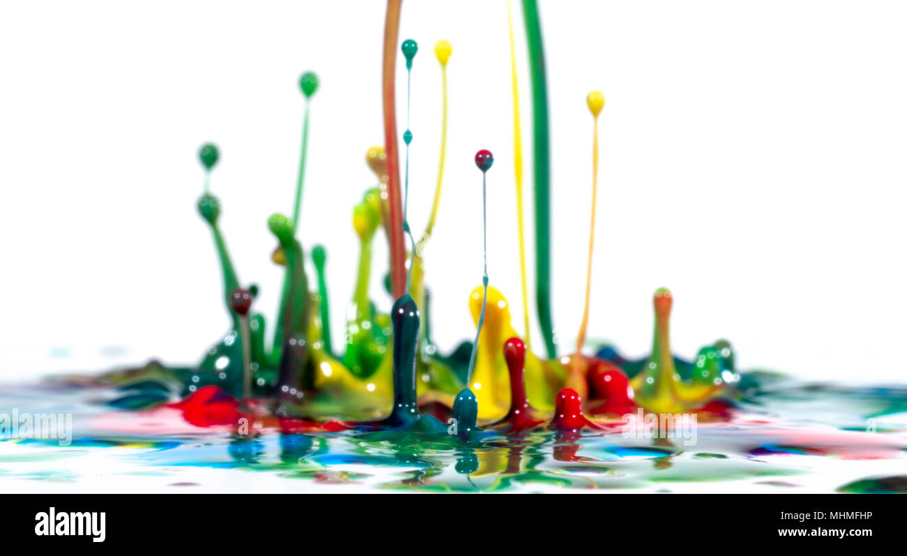 Splash of color ink on white background Stock Photo - Alamy
