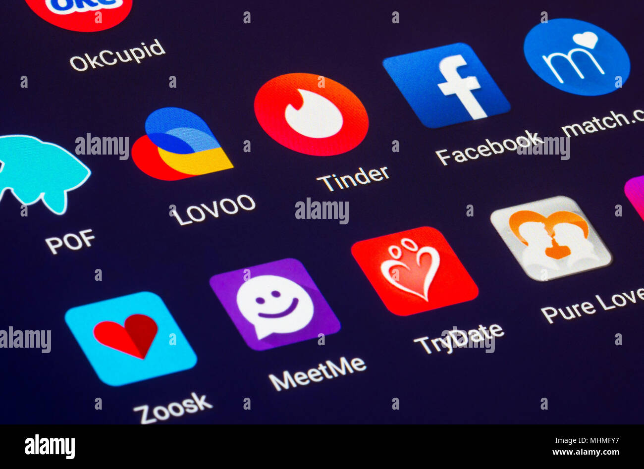 Online dating concept. Dating app icons on a tablet display screen. Online dating concept. Dating online concept. Stock Photo