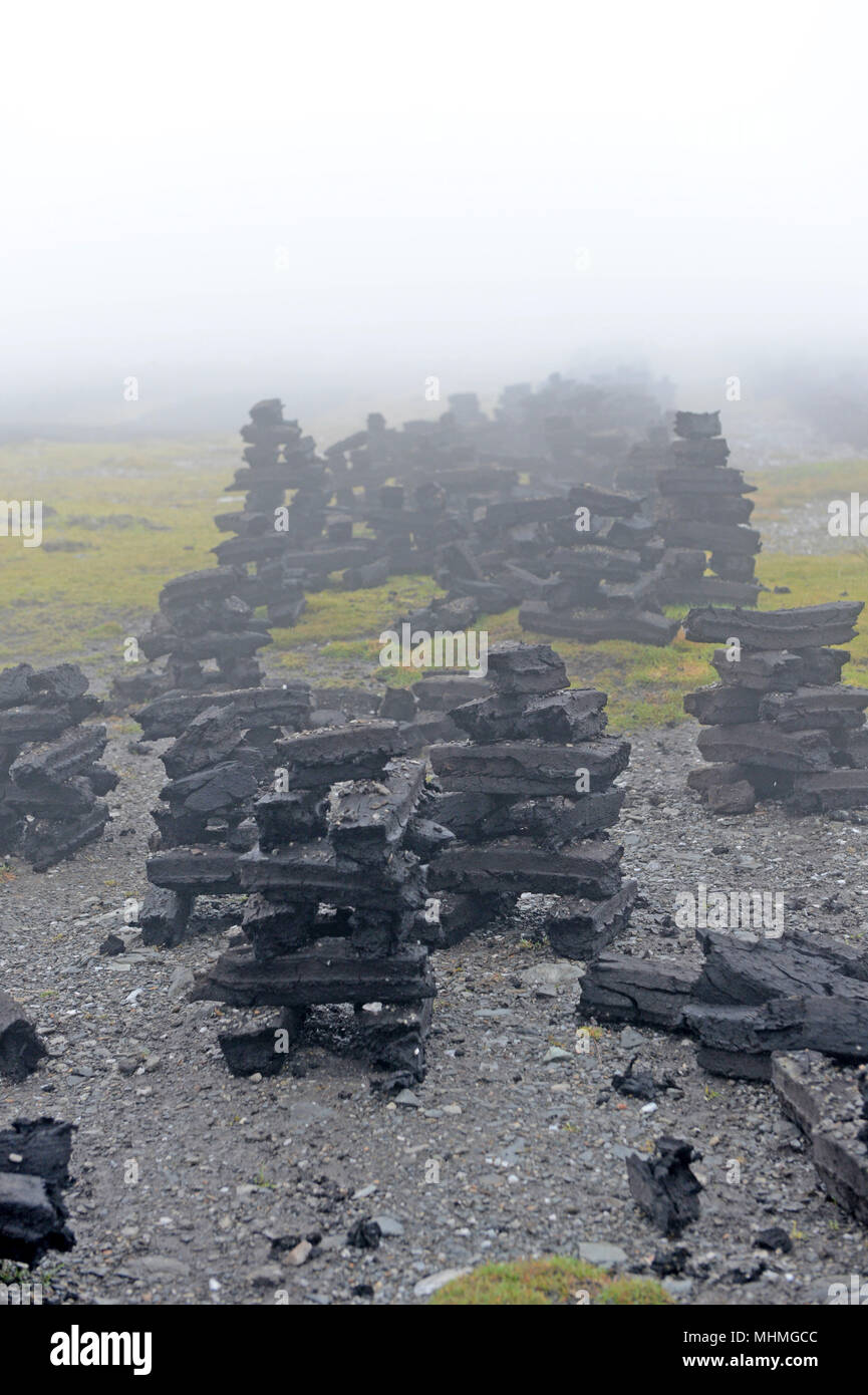 Industrialised peat cutting to make brackets for home use to burn on fires in the Shetland Isles Stock Photo
