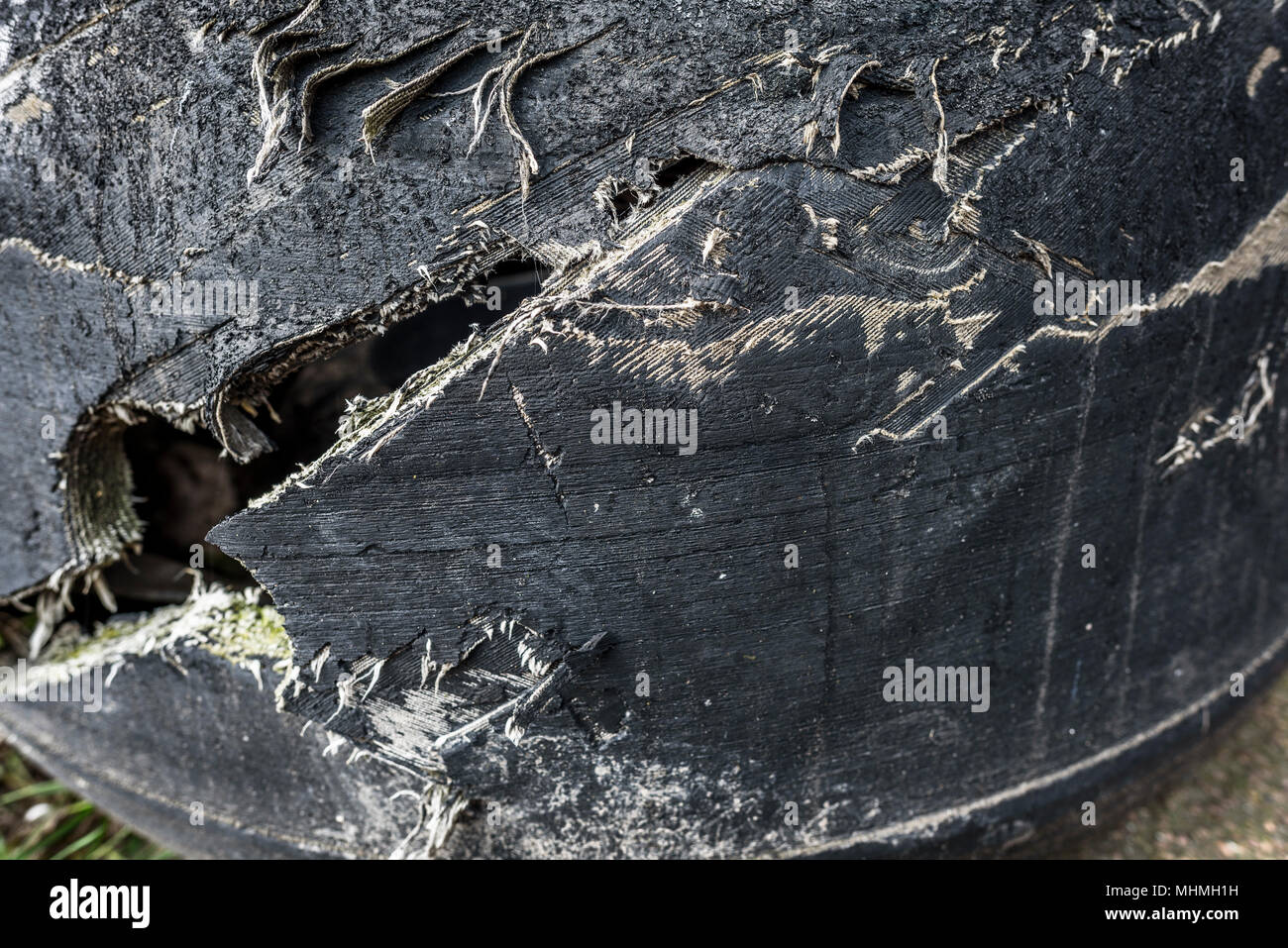 Blown out heavy duty truck tyre detail. Stock Photo