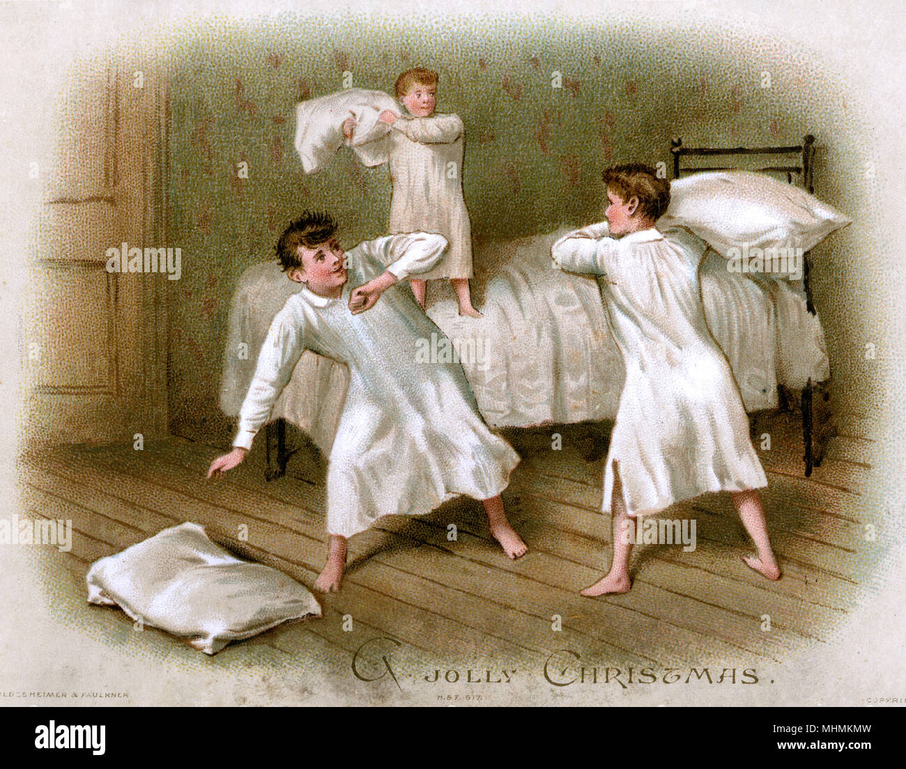 Three boys stage a pillow fight in their nightgowns      Date: circa 1885 Stock Photo
