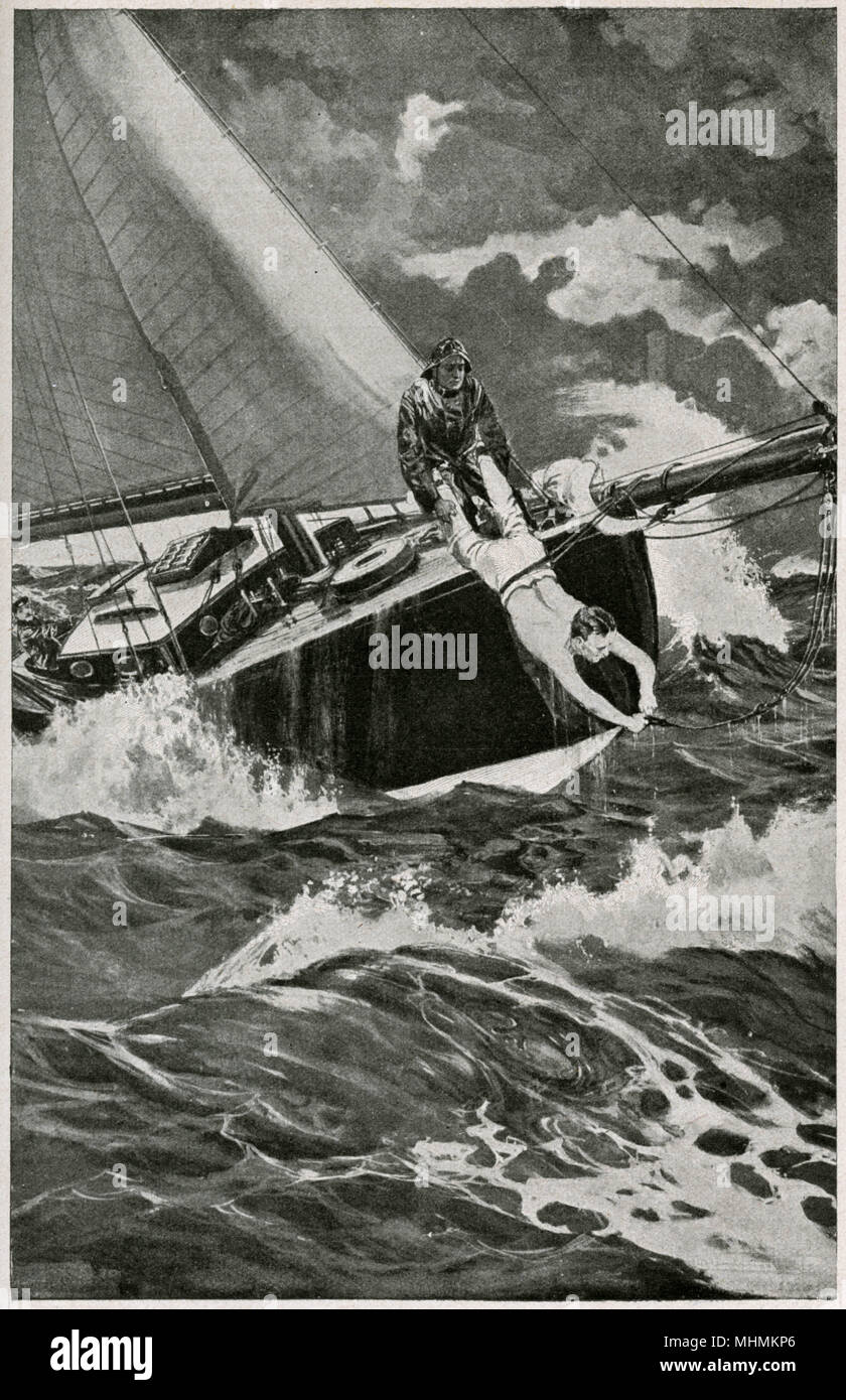 While out sailing, a rope breaks loose, and one of the crew has to fix it, while held by the legs by his companion..      Date: 1915 Stock Photo