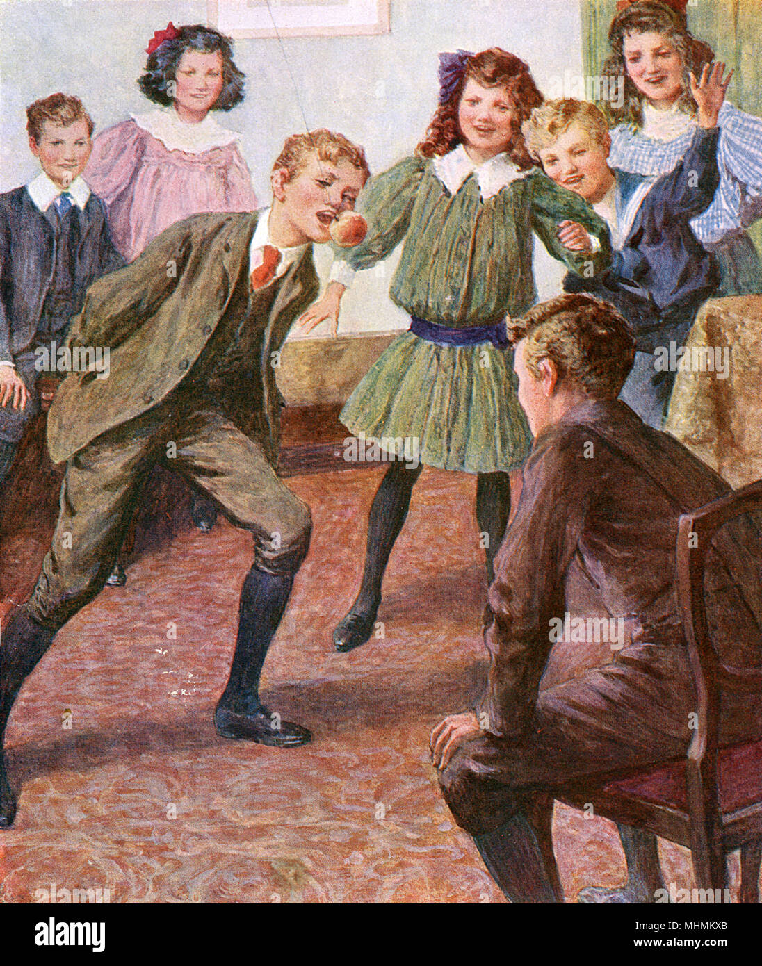 A group of smartly dressed children play a game of bob-apple at a party.       Date: circa 1890 Stock Photo