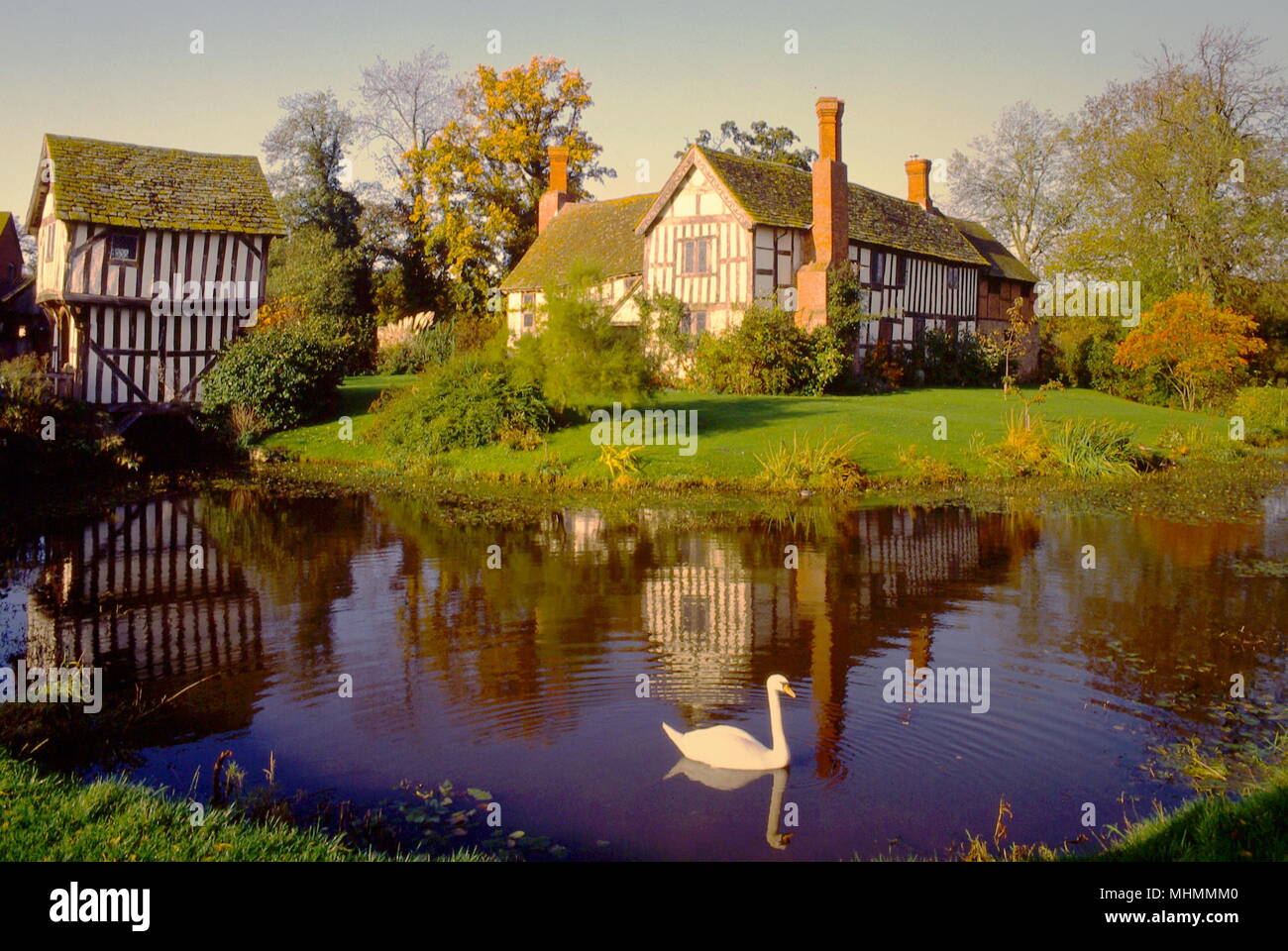 A view of Lower Brockhampton Manor House on the Herefordshire-Worcestershire borders.  The timber-framed house dates back to the late 1300s.  It is surrounded by a moat and is entered via a timber-framed gatehouse. Stock Photo