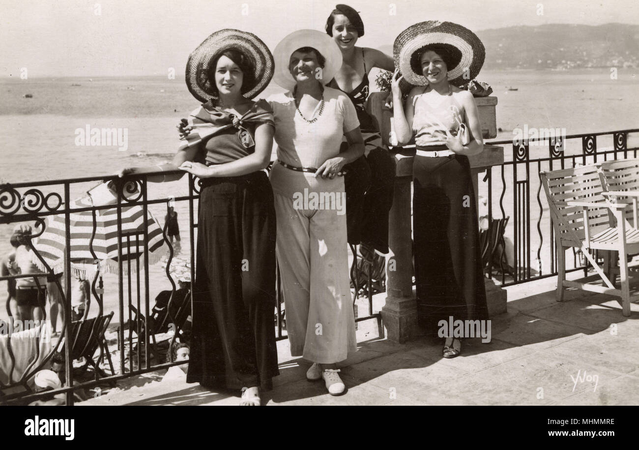 A group of women dressed fashionably in beach pyjamas at the resort of Juan-les-Pins on the French Riviera in the early 1930s. Stock Photo