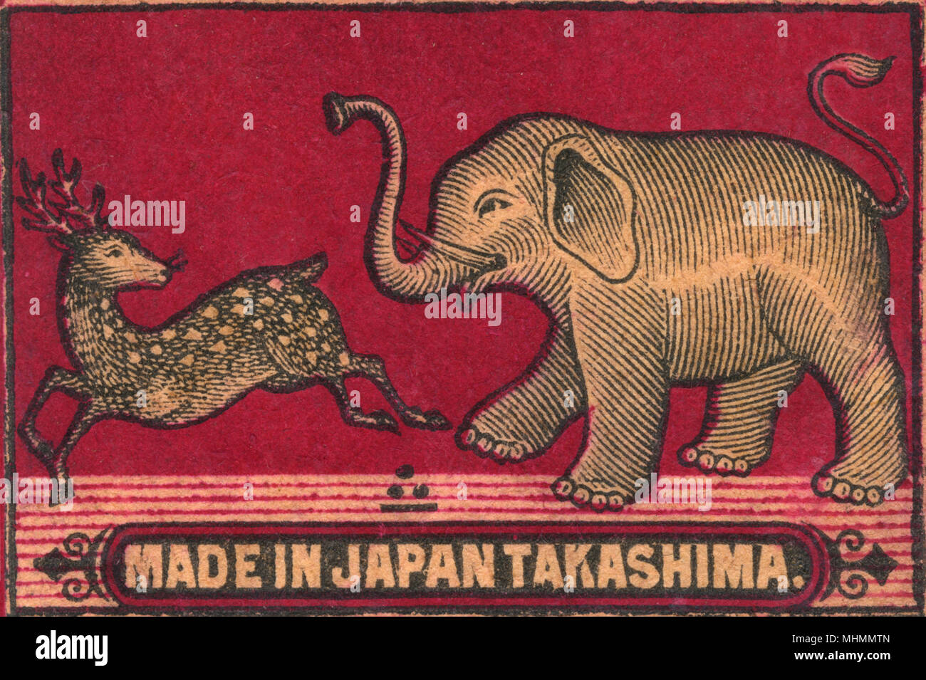 Old Japanese Matchbox label with an elephant chasing a deer made by Takashima in Japan      Date: c. 1910s Stock Photo