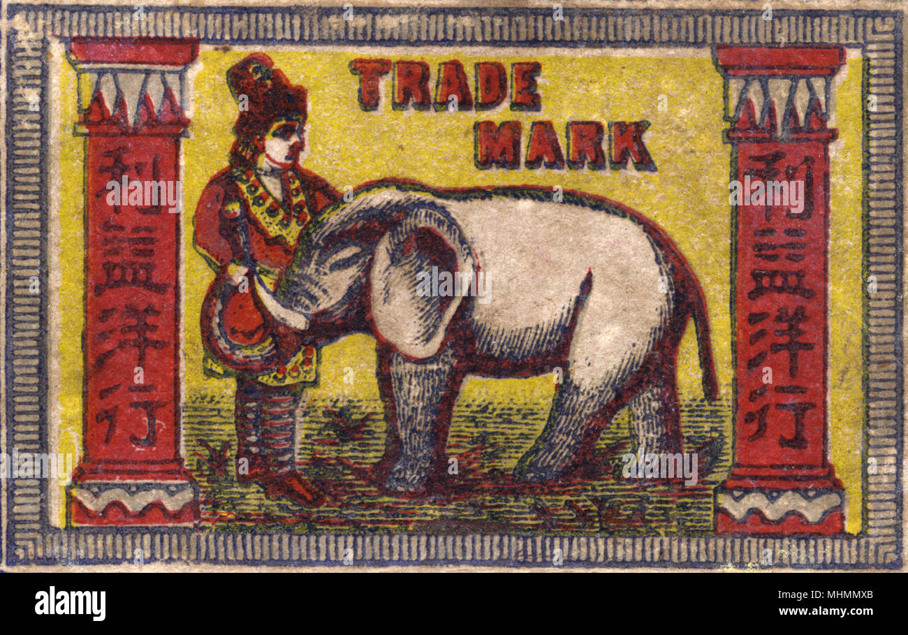 Old Japanese Matchbox label with a man with an elephant Stock Photo