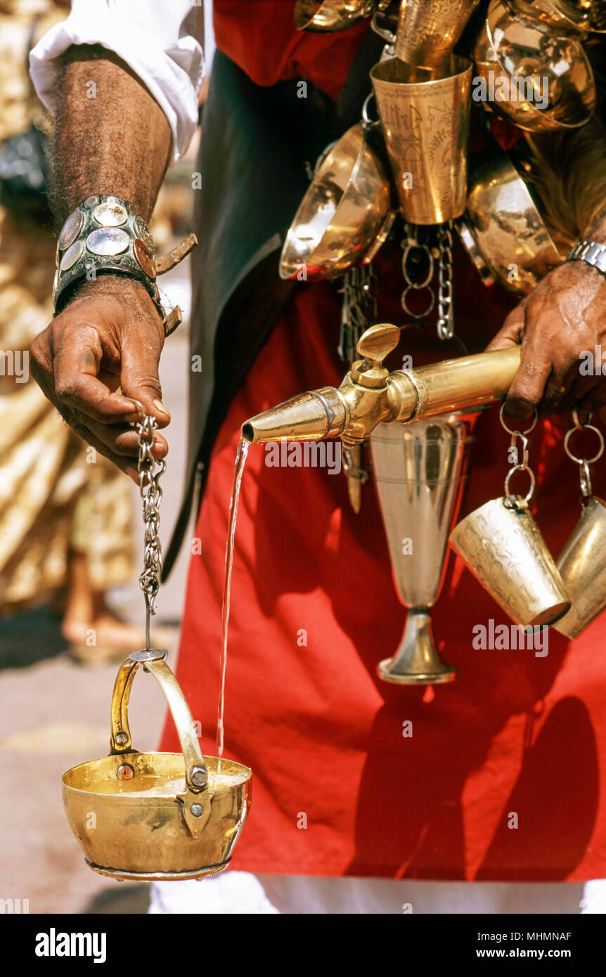 Marrakesh, Morocco; traditional water seller with brass cups in the Djemaa el Fna Stock Photo